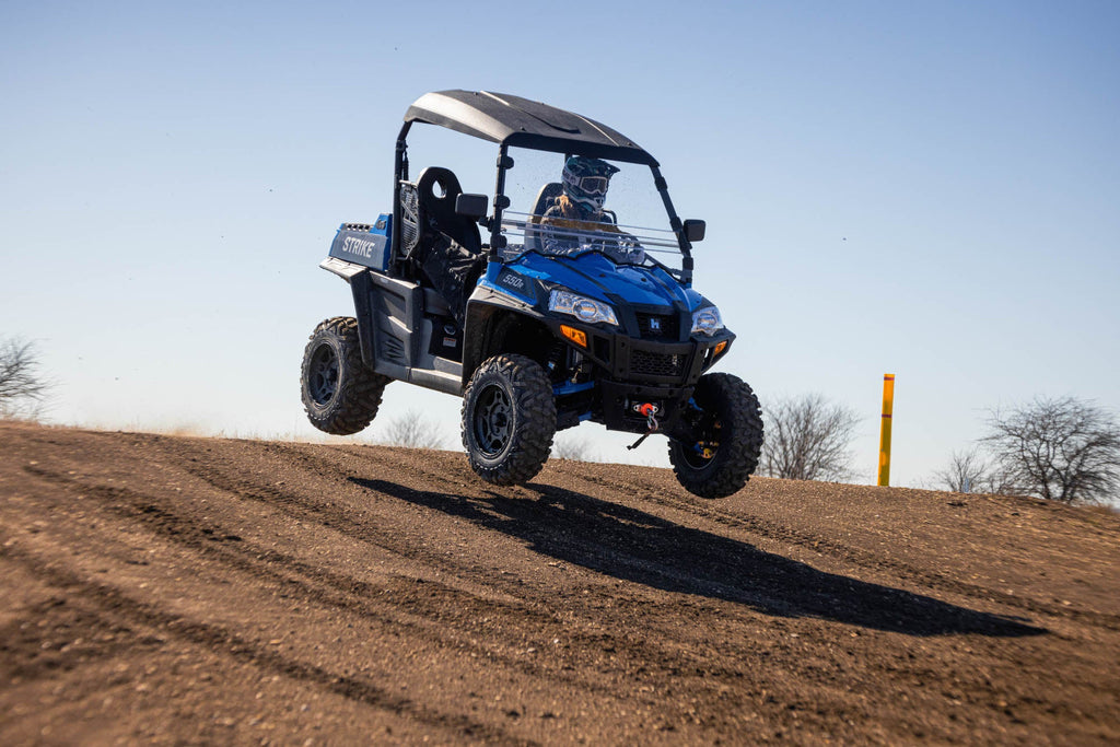 Hisun Powersports jumping a small hill